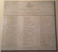 Marble plaque with three columns of engraved names of those who died during World War 2
