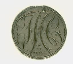 Round, silver medal with the initials F.H.C written in script