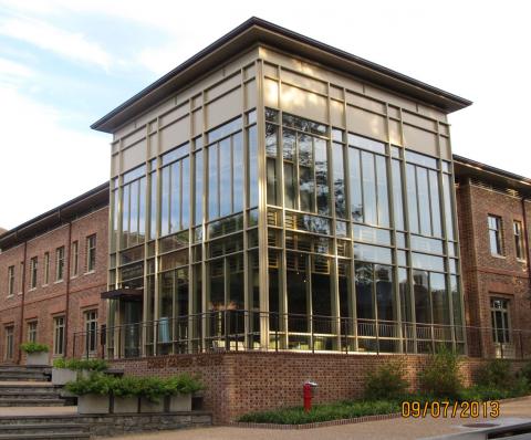 Two story solid glass walled building on the corner of the Sadler Center
