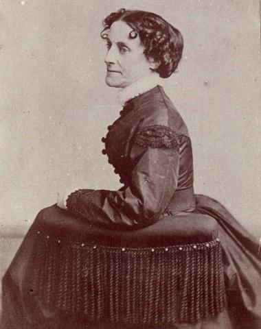Black and white side portrait of Elizabeth Van Lew, seated in a full dark dress