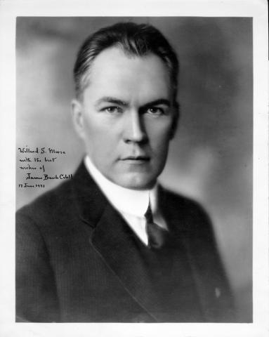 Black and white portrait of James Cabell facing forward and wearing a dark suit and tie