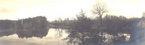 Black and white photo that has yellowed with age of the lake