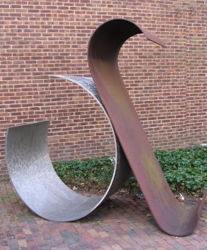 Metal statue of two curled planes leaning against each other
