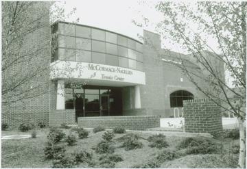 Front entrance to the tennis center, with curved glass entry