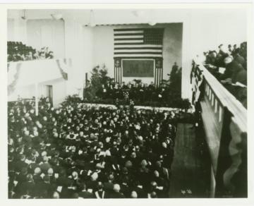 View from the balconies of a large audience in the auditorium in Ewell Hall