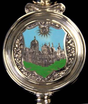 Reverse side of the Rector's badge featuring an illustration of old campus in green and blue