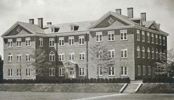 Black and white of James Blair hall, a three story brick building with wings on both sides