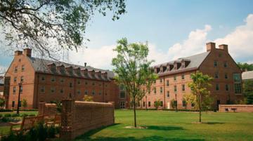 Jamestown Residence, a four story, brick L-shaped building with large field in front