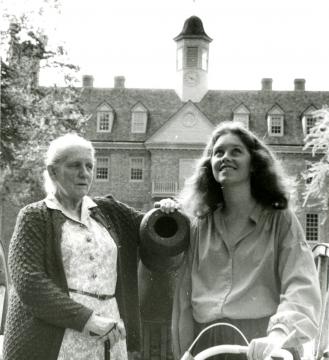 Coleman and her daughter next to a cannon in front of the Wren Building