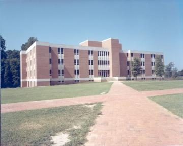 Jones Hall after construction in 1969, a three story brick building with brick sidewalks