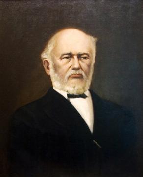 Portrait of Ewell wearing a dark suit and bow tie